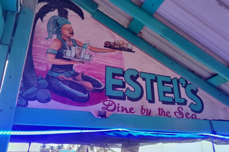 Estel's Dine By The Sea business sign.